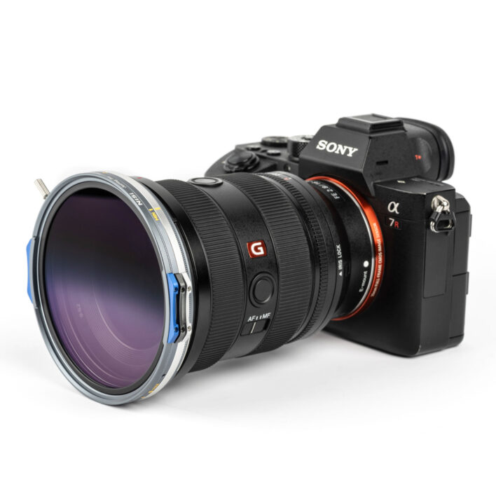 Gradient lens filter with blue and silver frame on a white background