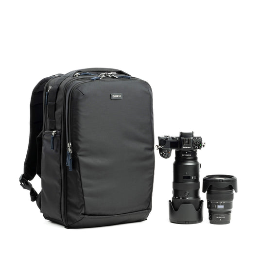 Dark gray camera backpack with front zipper pockets and padded shoulder straps