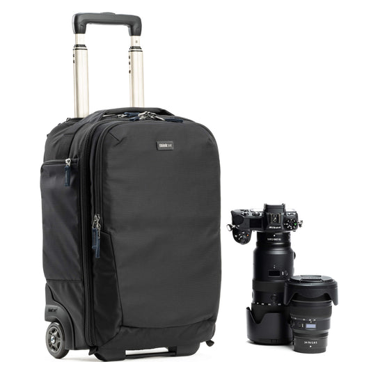 Dark rolling backpack with telescoping handle, front zipper pocket, small wheels