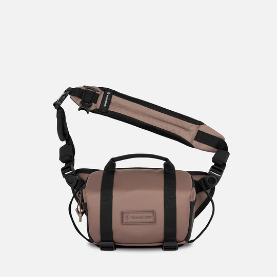Clay colored bag with a visible brand logo on a white background