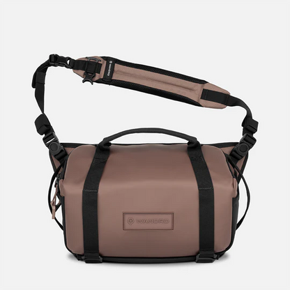 Brown bag with black straps on a white background