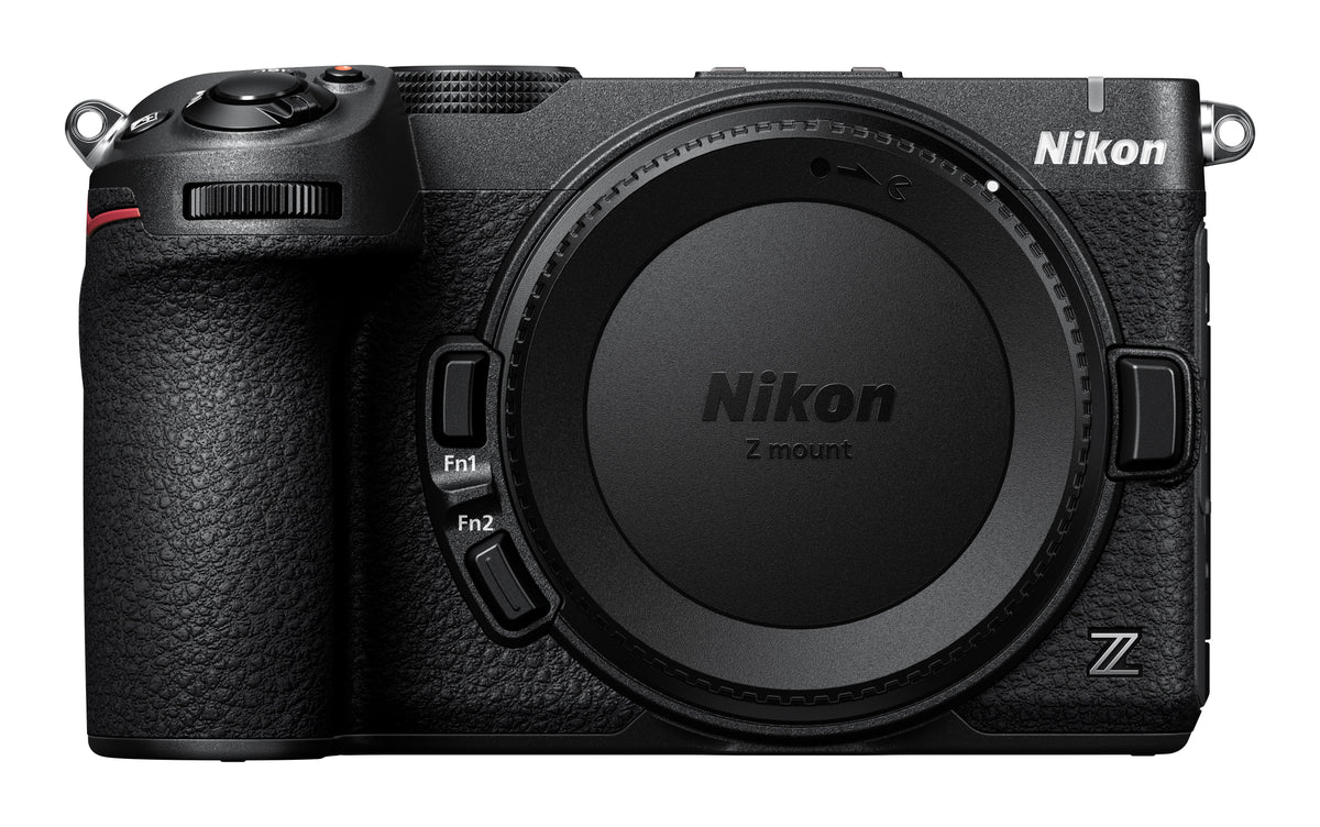 A Nikon mirrorless camera body in black, shown from the front with the lens removed and a Nikon Z-mount lens cap installed. The Nikon logo is visible on the top right and on the lens cap.