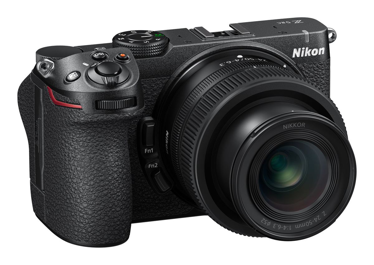 A Nikon mirrorless camera with a zoom lens, shown from a three-quarters angle on a solid white background.