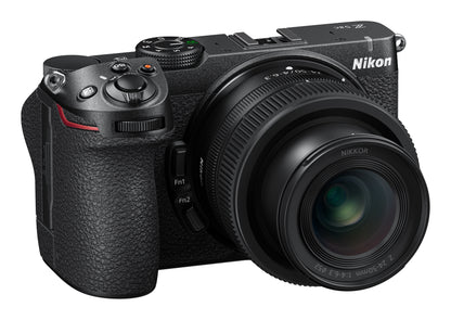 A Nikon mirrorless camera with a zoom lens, shown from a three-quarters angle on a solid white background.